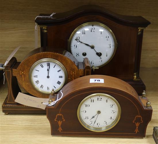 An Edwardian brass-mounted and line-inlaid mantel clock in architectural case and two smaller similar clocks
